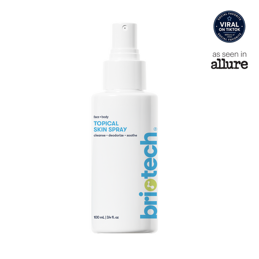 A 100 mL Topical Skin Spray bottle with a white label, blue text, and a circular Viral on TikTok badge in the upper right.